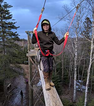 Student on ropes course
