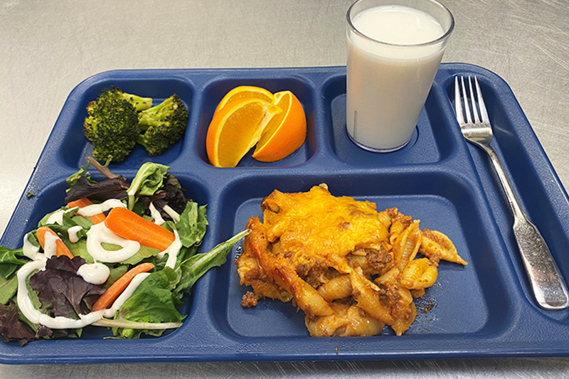 Hamburger casserole, roasted broccoli, green salad, fruit, and milk